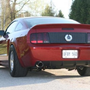Smoked Tail Lights, Silver Horse Racing Honeycomb Deck Lid Panel and Stack Racing Black Tail Light Trim Bezels.