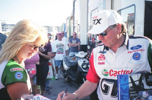 John Force & my wife getting my Castrol jacket signed