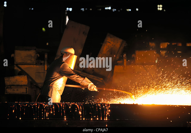 worker-using-torch-cutter-to-cut-through-metal-cpaja7.jpg