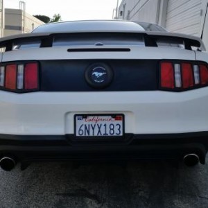 Black bezel around the tail lights and black lid around the emblem