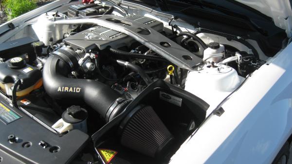 In this pic you can see my custom strut tower bar that helps the over all looks of the stock motor... I designed it and my dad built it. He did a grea